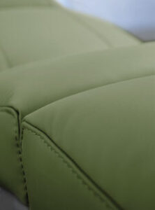 Luxurious green treatment table upholstery detail by Gharieni Spa Equipment.
