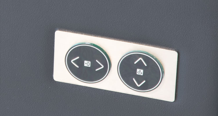 Gharieni spa table control panel with dual circular buttons for premium treatment settings.