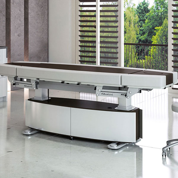 Gharieni luxury spa treatment table in modern, serene wellness setting.