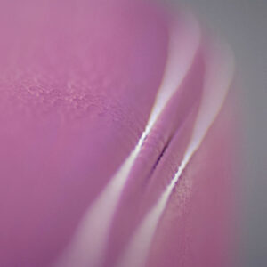 Luxurious pink leather texture detail on Gharieni spa treatment table.