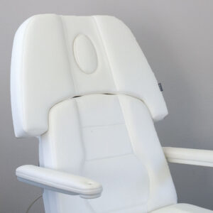 Luxurious white Gharieni spa treatment table, ergonomic design, premium comfort.