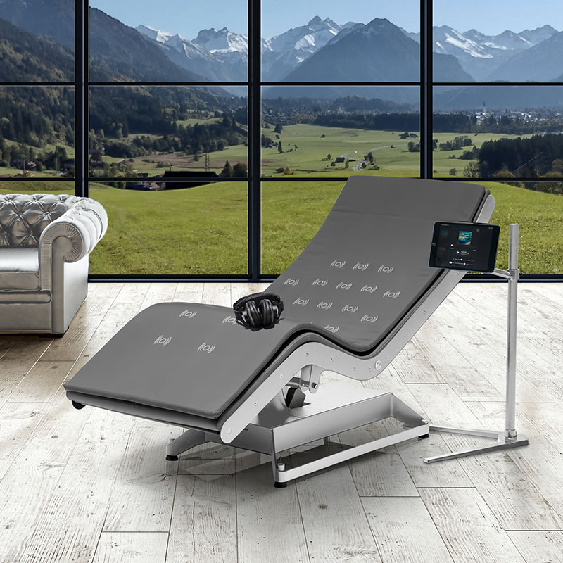 Luxurious Gharieni spa treatment table in scenic mountain-view room.