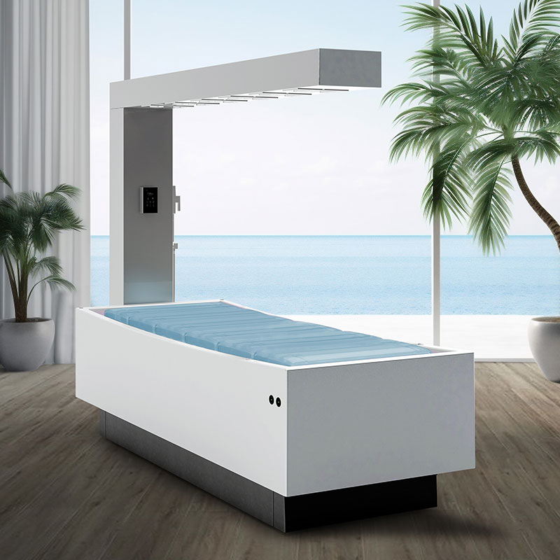 Luxurious spa treatment table by Gharieni with ocean view and palm trees.