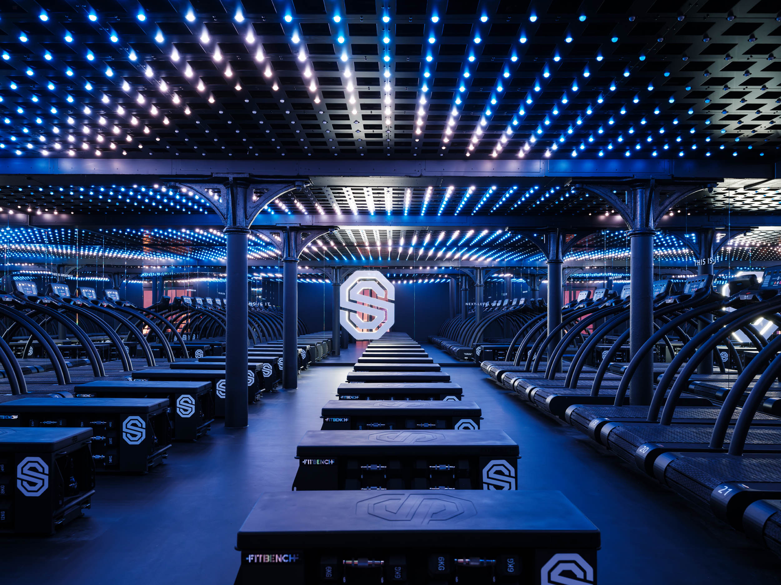 Luxurious spa treatment tables under ambient LED lighting at Gharieni showroom.
